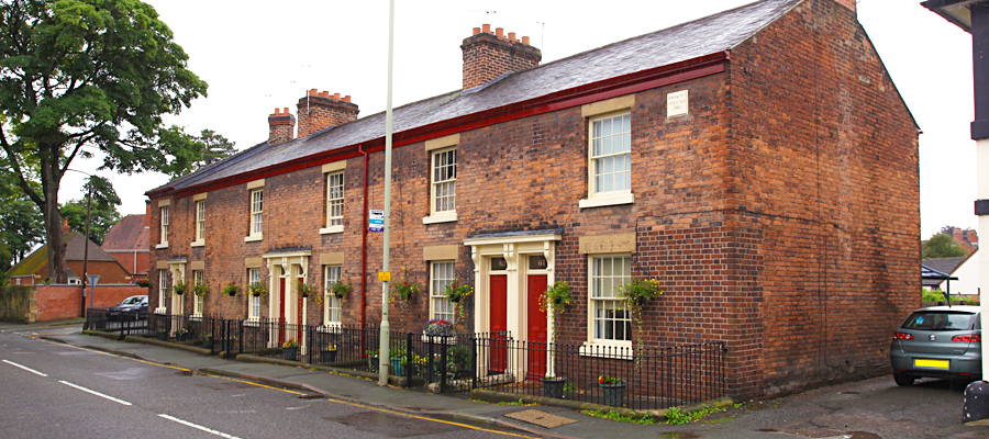 Red powder coated traditional round cast downpipes