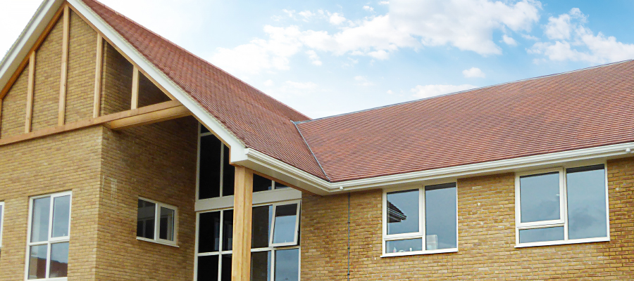 Aluminium primary trio fascia fitted to residential home | Porthaven Aluminium primary trio, soffits, guttering and downpipes installed on care home